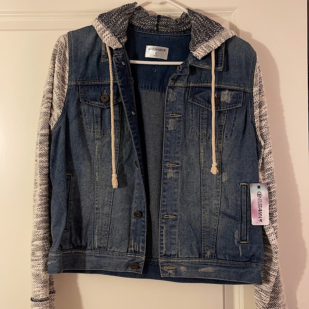 New jean jacket with cloth sleeves. Jacket has an attached hood.
